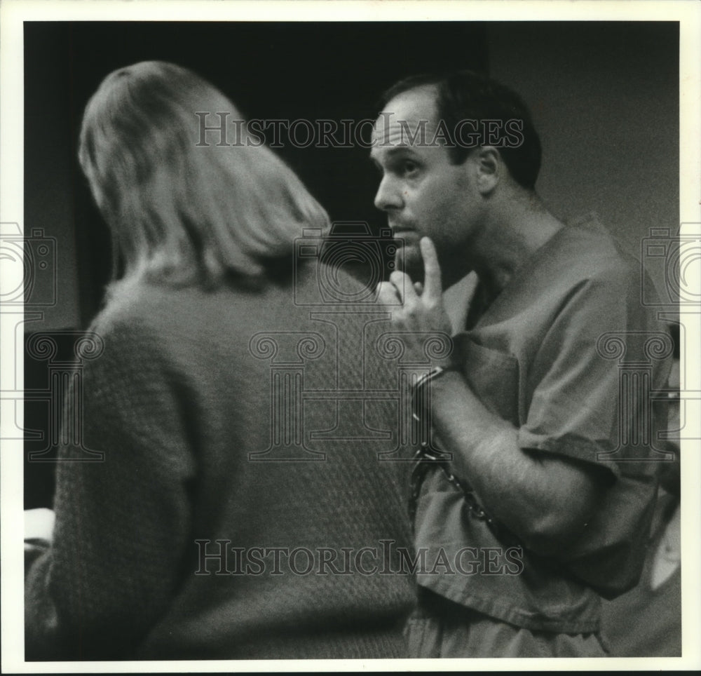 1993, Rick Spaude listens to lawyer Katherine Zebell in Court. - Historic Images