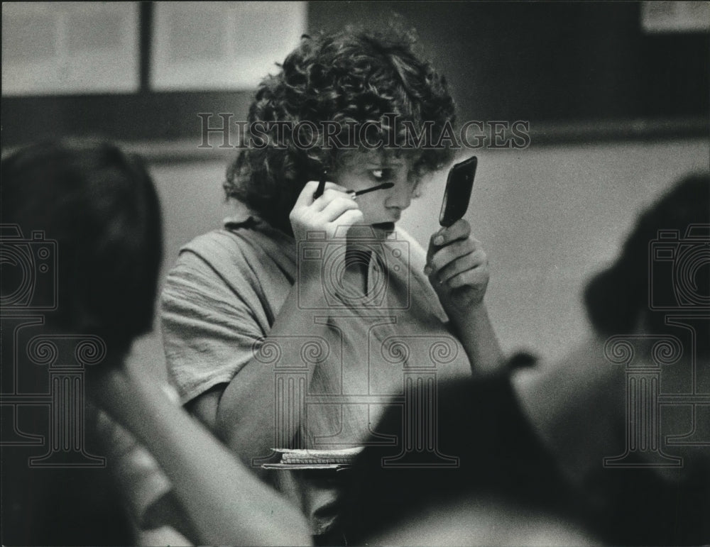 1982, Kris Mitchell touches up makeup in class, Grafton High School - Historic Images