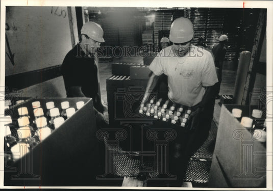 1992, Coca Cola employess with water for Hurricane Andrew victims - Historic Images