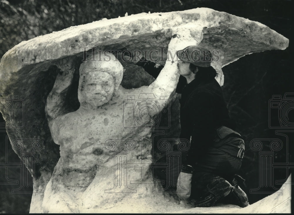 1990 Ed Howland creates snow sculpture at competition in Milwaukee - Historic Images