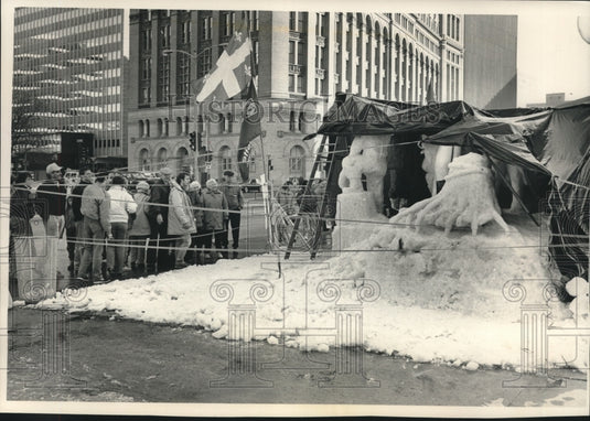 1989 Press Photo Plastic sheets cover snow sculptures at Snow Sculpting contest. - Historic Images