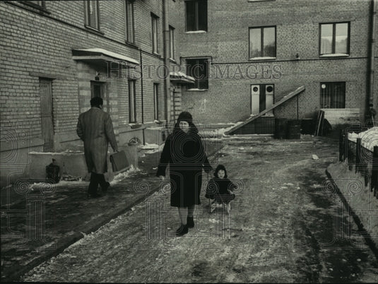 1965 Press Photo Women pulls baby on sled through street, Russia - mjc01538-Historic Images
