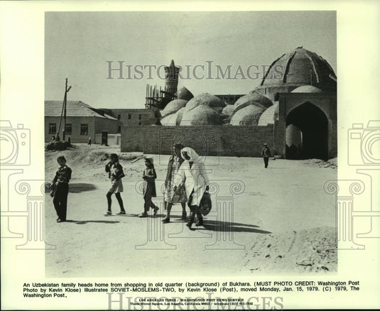 1979, An Uzbekistan family heads home from shopping in Bukhara,Russia - Historic Images