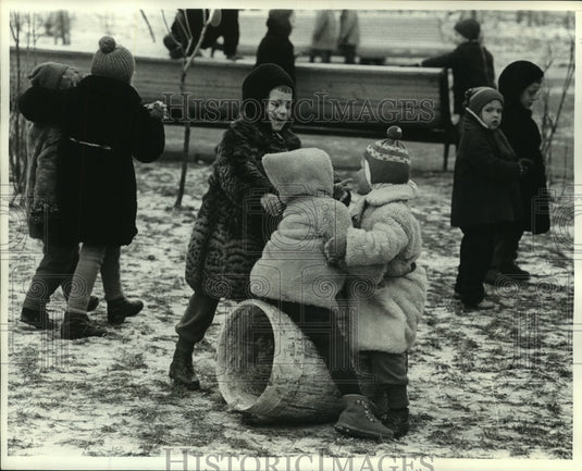 1964 Press Photo Youngsters play in season's first snow in Moscow, Russia-Historic Images