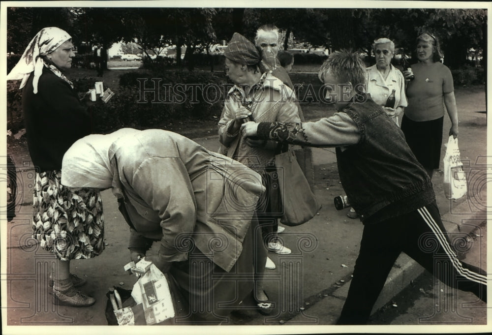 1993, A Moscow, Russia street kid steals a bottle of soda - mjc01653 - Historic Images