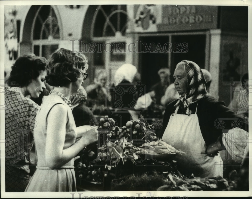 1965, UPI Correspondent Barbara Longworth in Moscow's peasant market - Historic Images