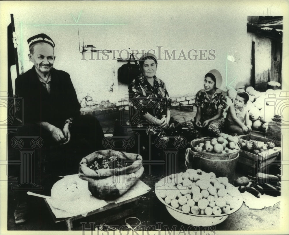 1984, Russian family selling fruit and vegetables in city of Tashkent - Historic Images