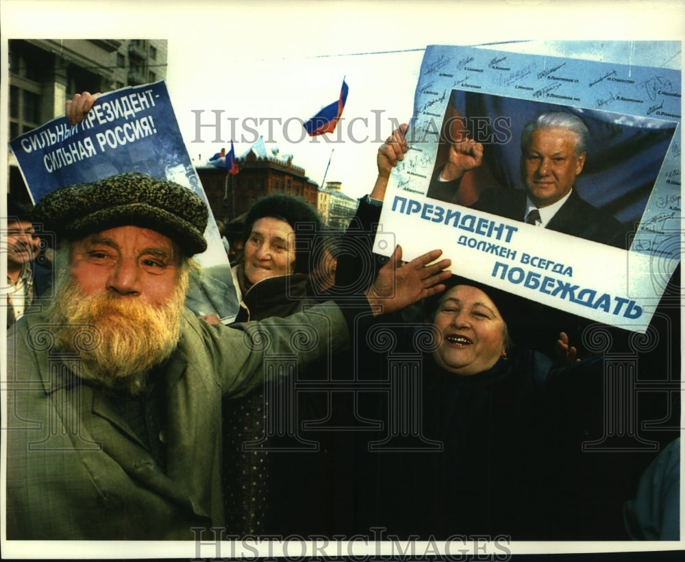 1993, Boris Yeltsin supporters with posters saying he must always win - Historic Images