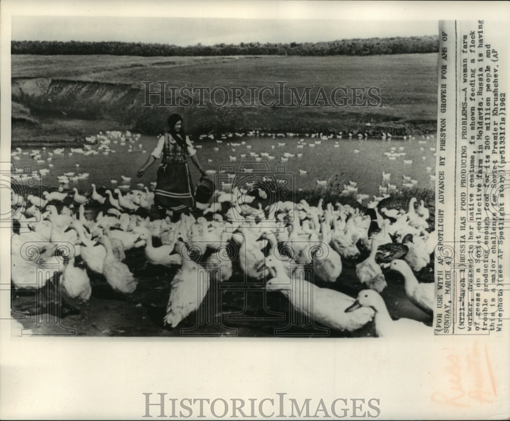 1962 Press Photo Women feeds ducks, Moldavia, Russia collective farm - mjc01905 - Historic Images