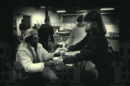 1988, Colleen Scanlan serves guests at St. Gall's Catholic Church - Historic Images
