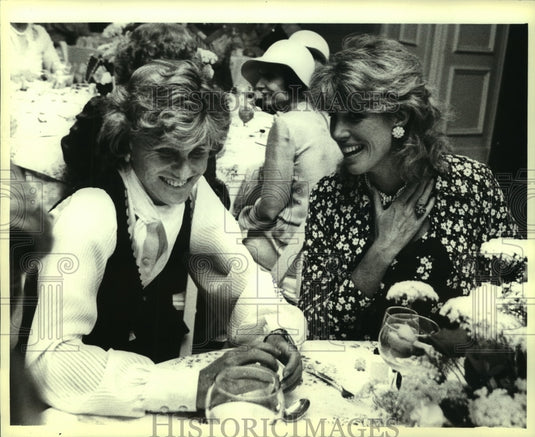 1977, Jean Kennedy Smith and Alexandra Schlesinger at fashion show. - Historic Images