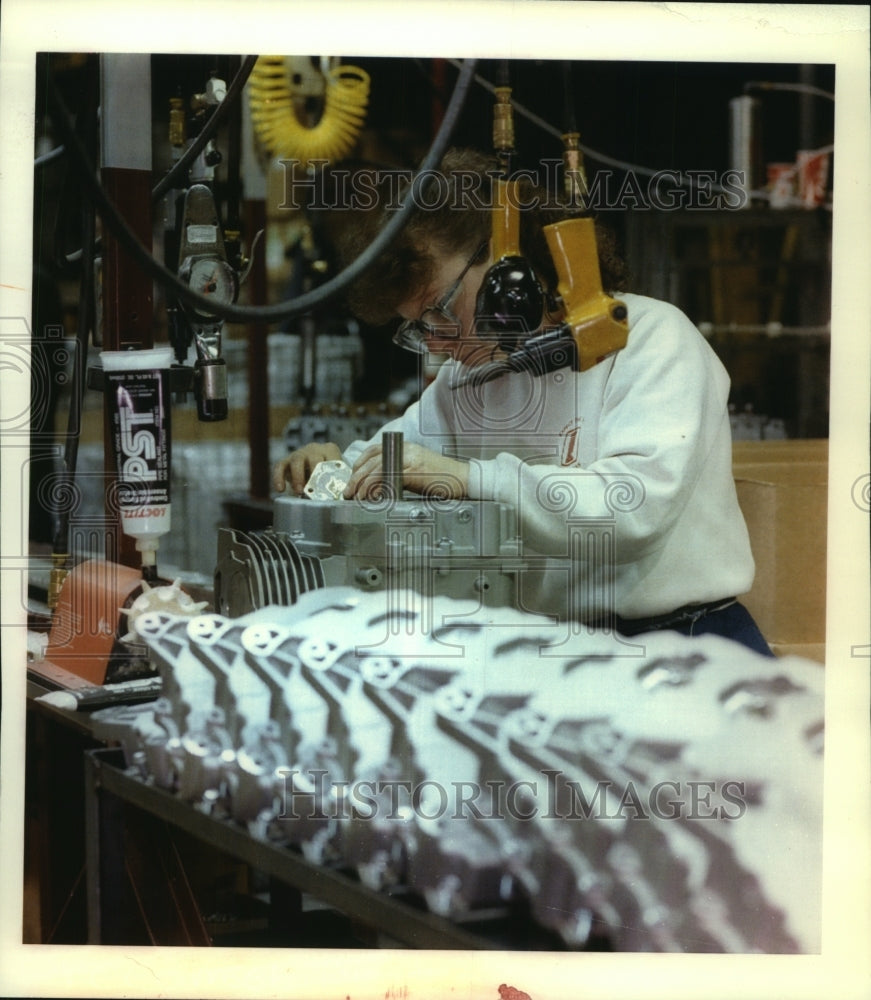 1994, Tecumseh Products Co. employee Kathy Schmitz at work - Historic Images