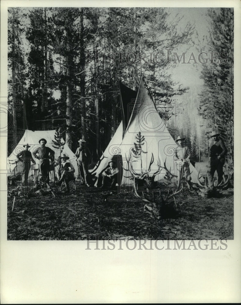 1985 Men camping in tent and teepee - Historic Images