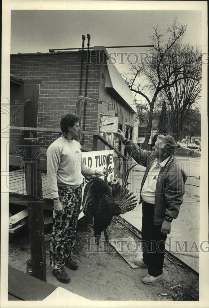 1989, Rick Kiedrowski and Gary Finnel register turkey in Gays Mills - Historic Images