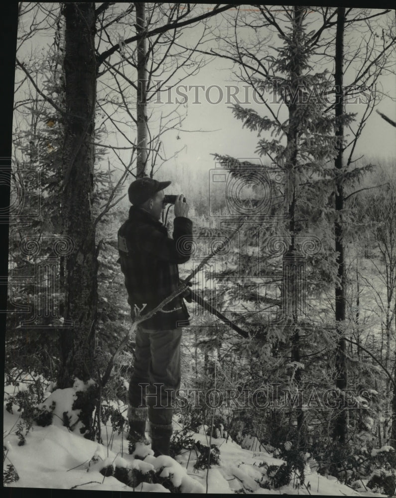 1954 Press Photo Hunter on a Ridge Watching the Valley in Winter - mjc02735 - Historic Images