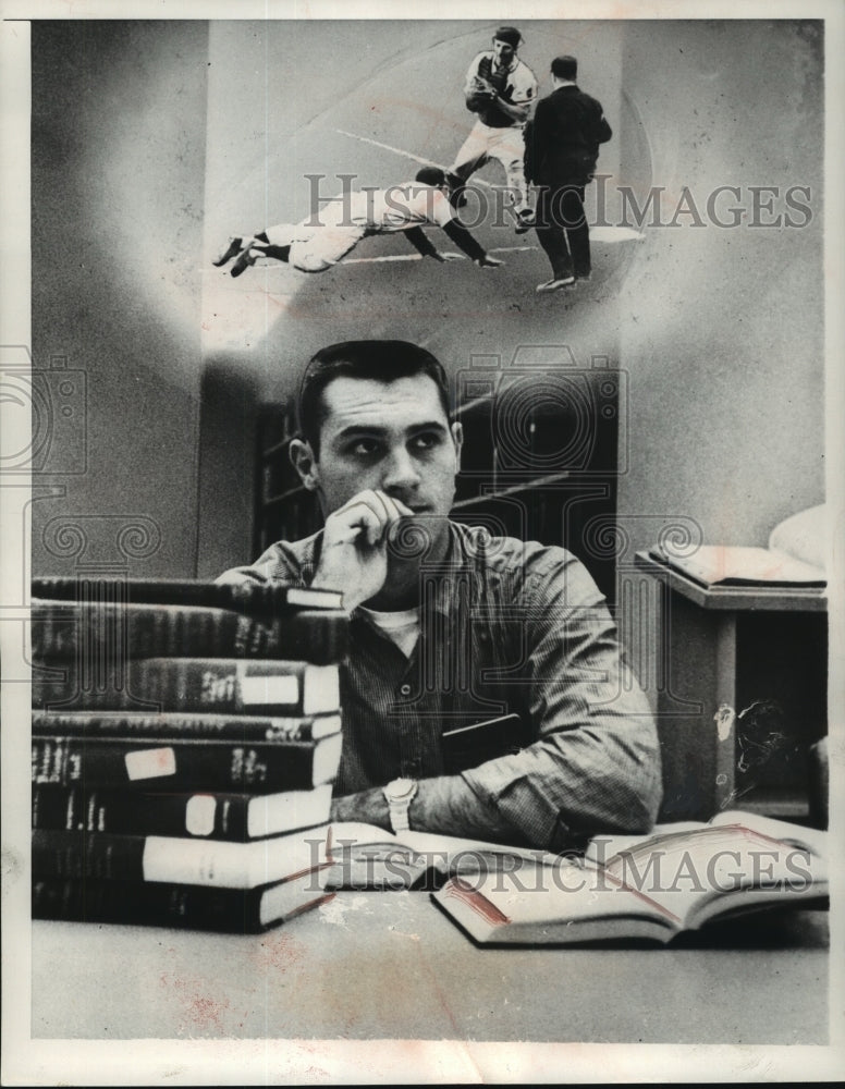 1957 Press Photo Bob (Hawk) Taylor Daydreams of Braves While Studying, Illinois - Historic Images