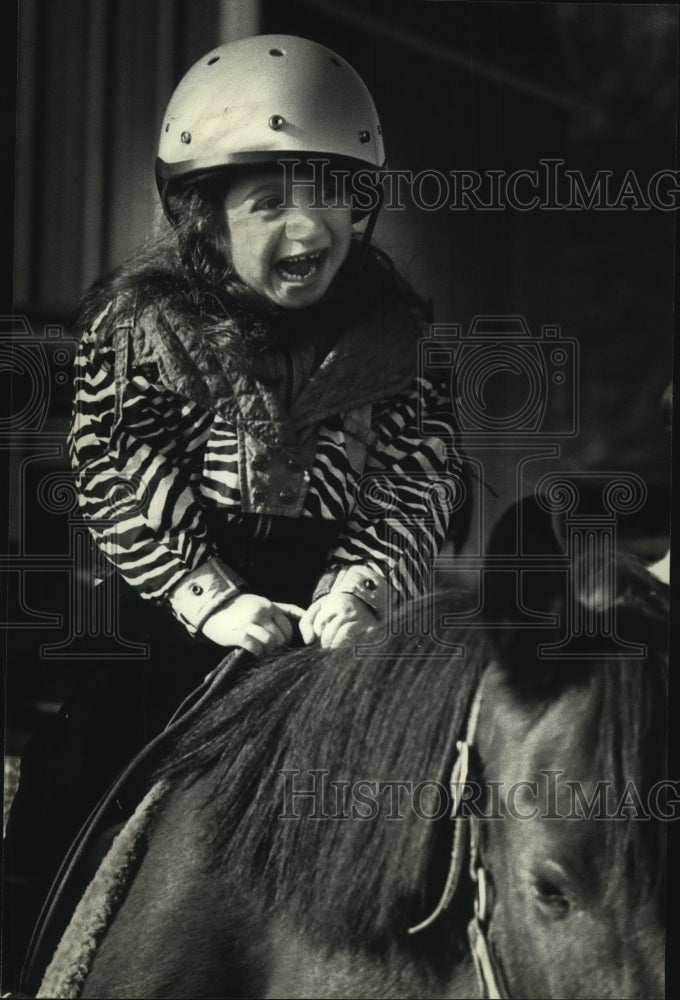 1991 Press Photo Bridgette on Horse Squealing of Excitement During Riding Lesson - Historic Images