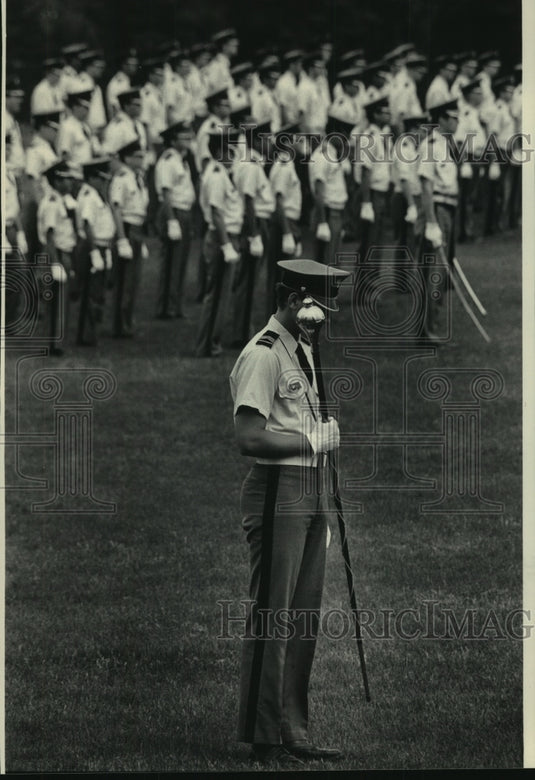 1986, Cadet at St. John's Military Academy in Delafield bows head - Historic Images