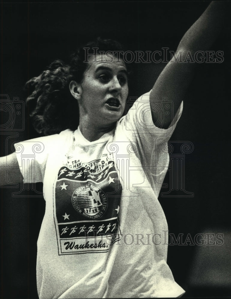 1991 Michele Guyant forward for Pius XI high school basketball squad - Historic Images