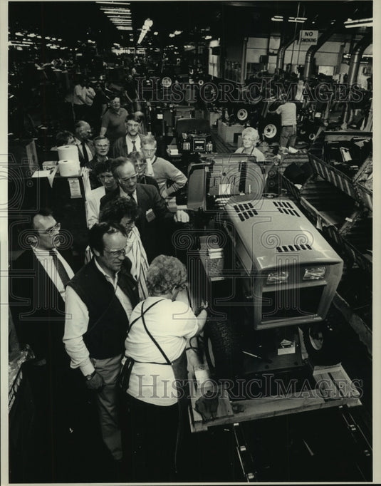 1989 Pam Herden assembles a Simplicity tractor, Port Washington - Historic Images