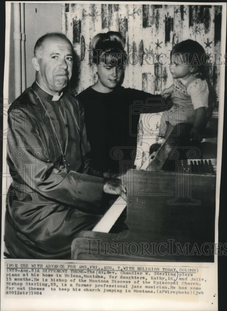 1964, Reverend Chandler Sterling at piano with daughters, Montana. - Historic Images