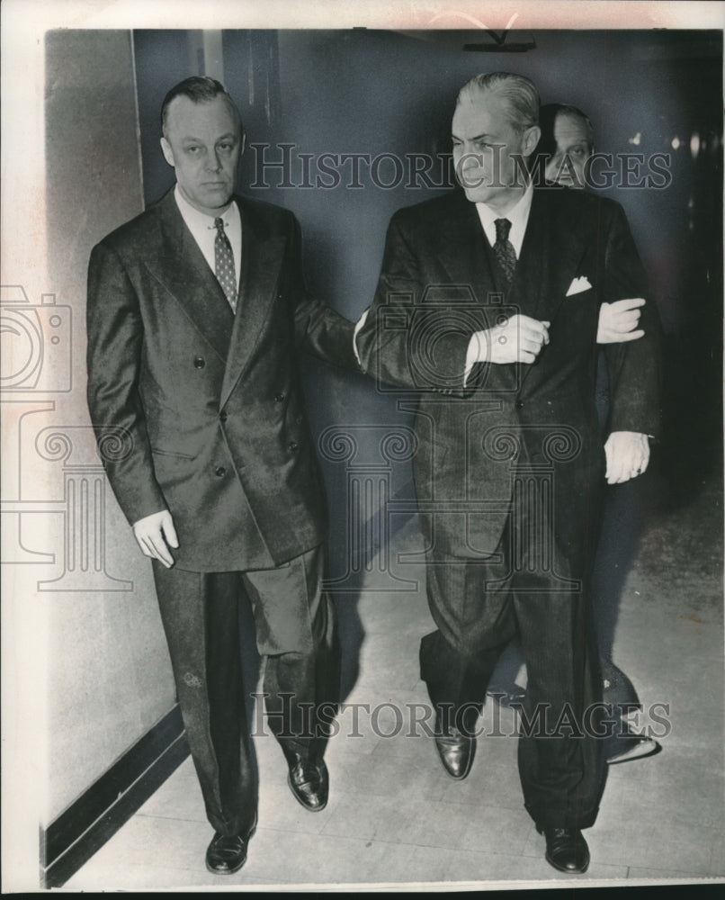 1957, FBI agents escort L. Ewing Scott in Detroit federal building - Historic Images