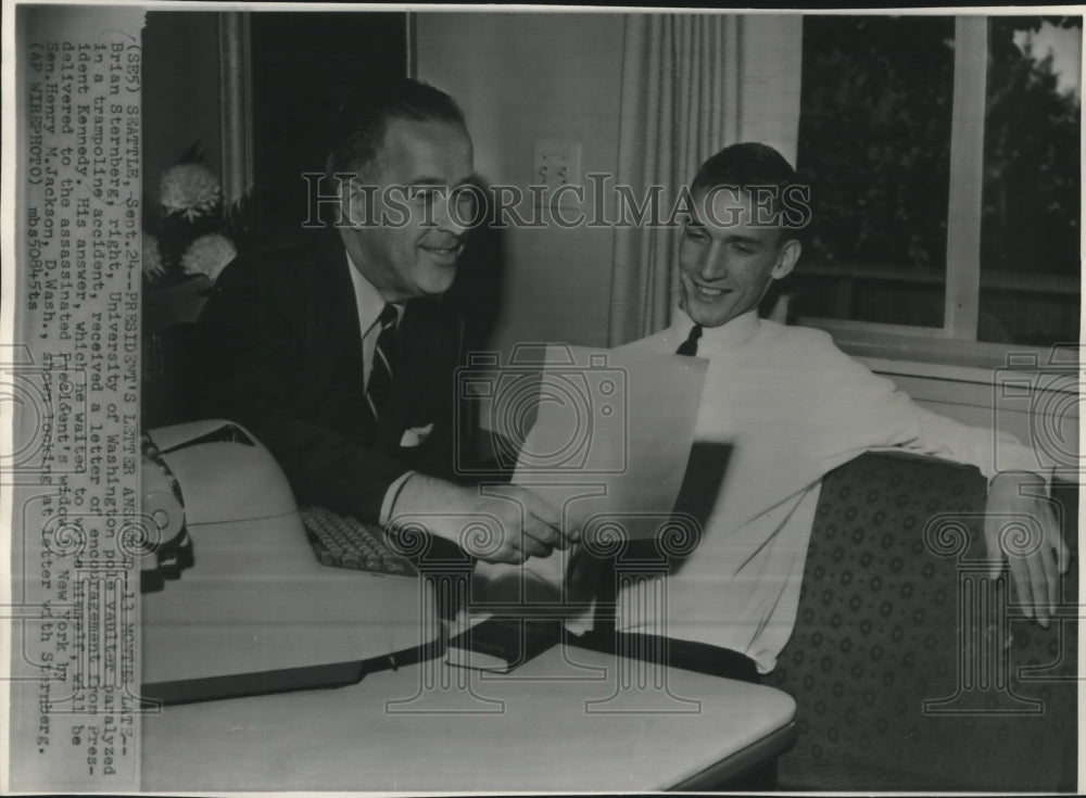 1964 Press Photo Brian Sternberg and Senator Henry Jackson reading letter - Historic Images