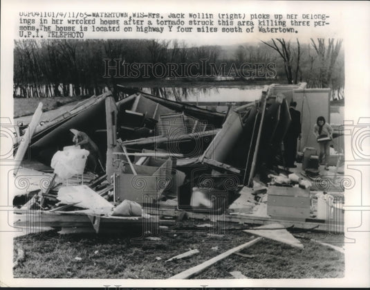 1965, Mrs. Jack Wollin Picks Up Her Belongings in Wrecked Home - Historic Images