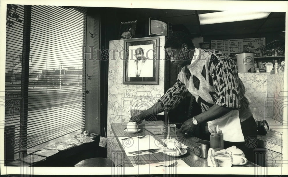 1990 A.O. Smith, Horace M. Gittens works at West Indies Restaurant - Historic Images