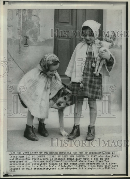 1966, Santina and Giuseppina Foglia, playing with dog and toys, Italy - Historic Images