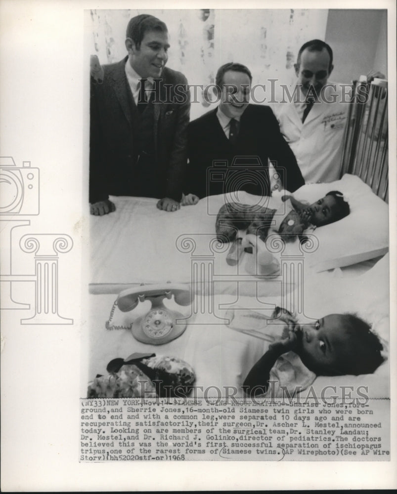 1968, Doctors view Jones Siamese twins after surgery in New York - Historic Images