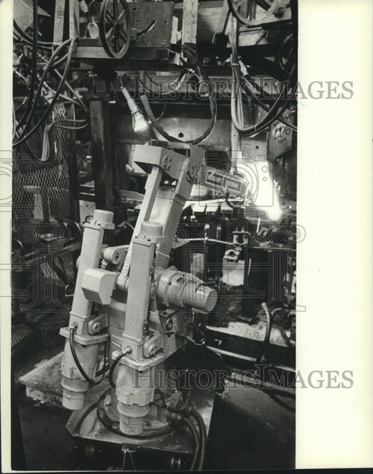 1982, A robot welds a van frame at the A.O. Smith Corporation - Historic Images