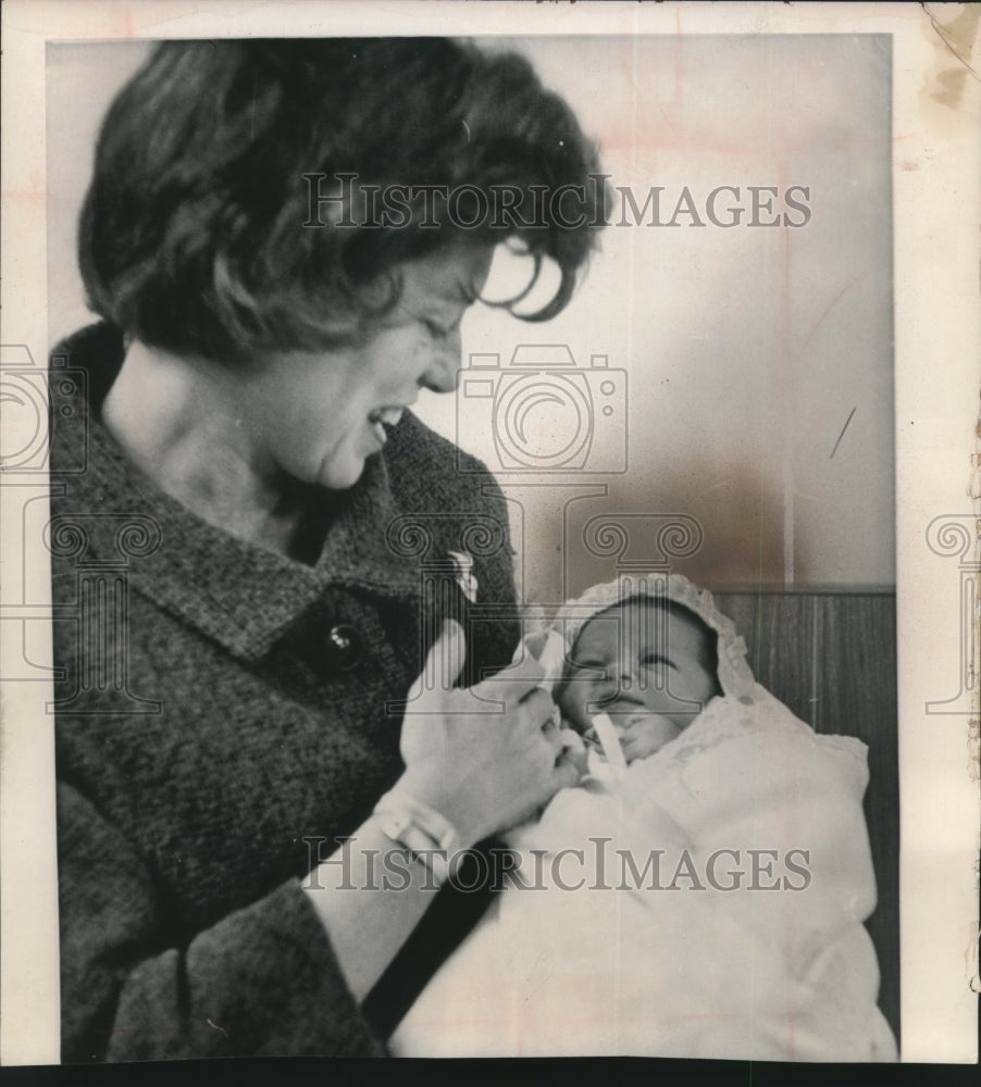 1964, Mrs. Sargent Shriver leaving hospital with child, Washington. - Historic Images