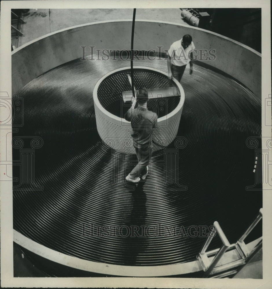 1963 Press Photo Workmen coil 23 mile length of cable on cable ship - mjc04367-Historic Images