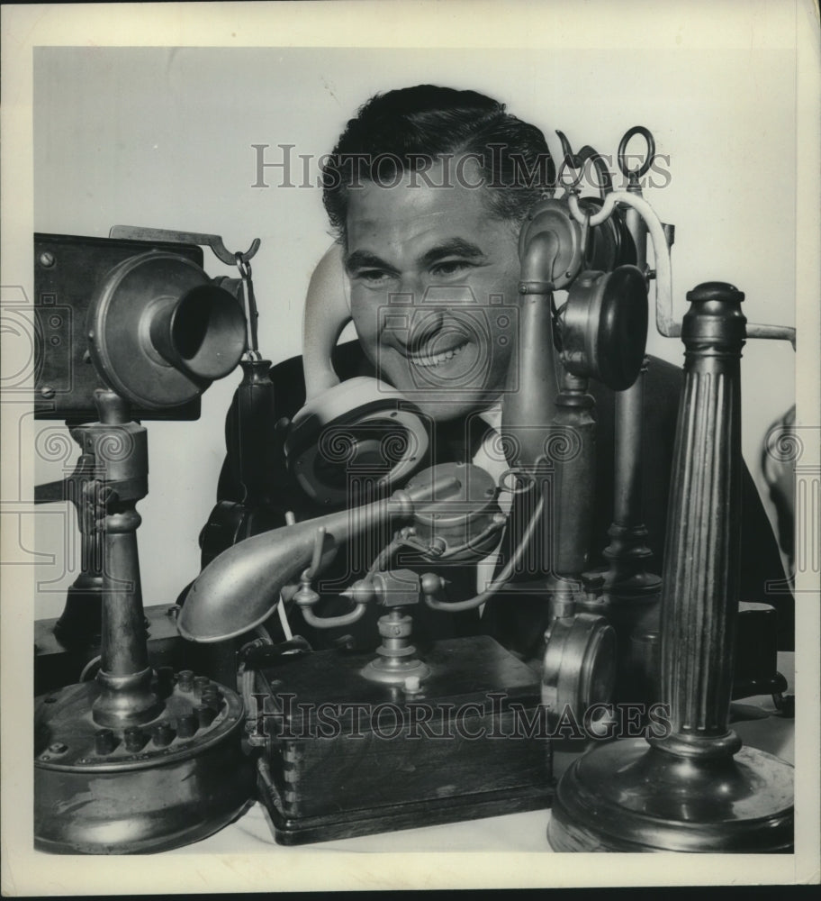 1963 Press Photo George Levine with variety of his antique phones New York - Historic Images