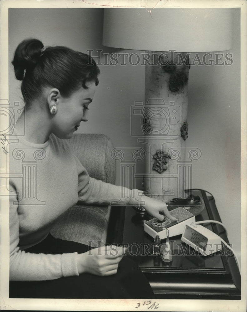 1958 Press Photo Speaker phone being tested by a woman Wisconsin - mjc04386 - Historic Images