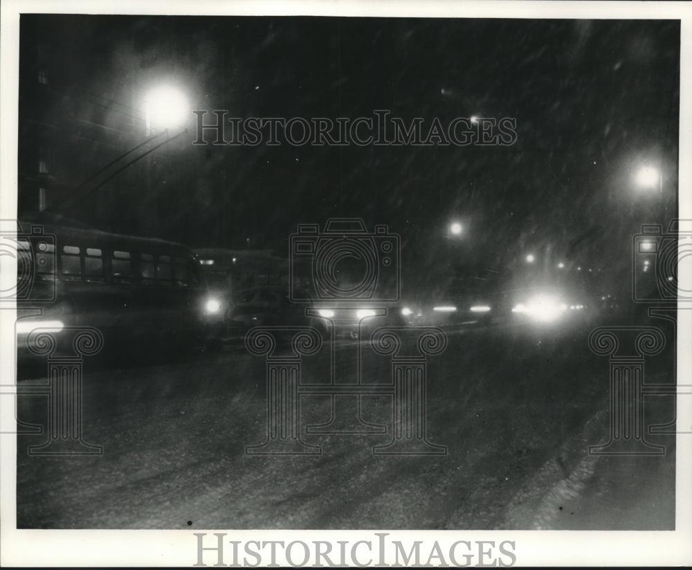 1962, Cars navigating snow covered highway in Milwaukee, Wisconsin. - Historic Images