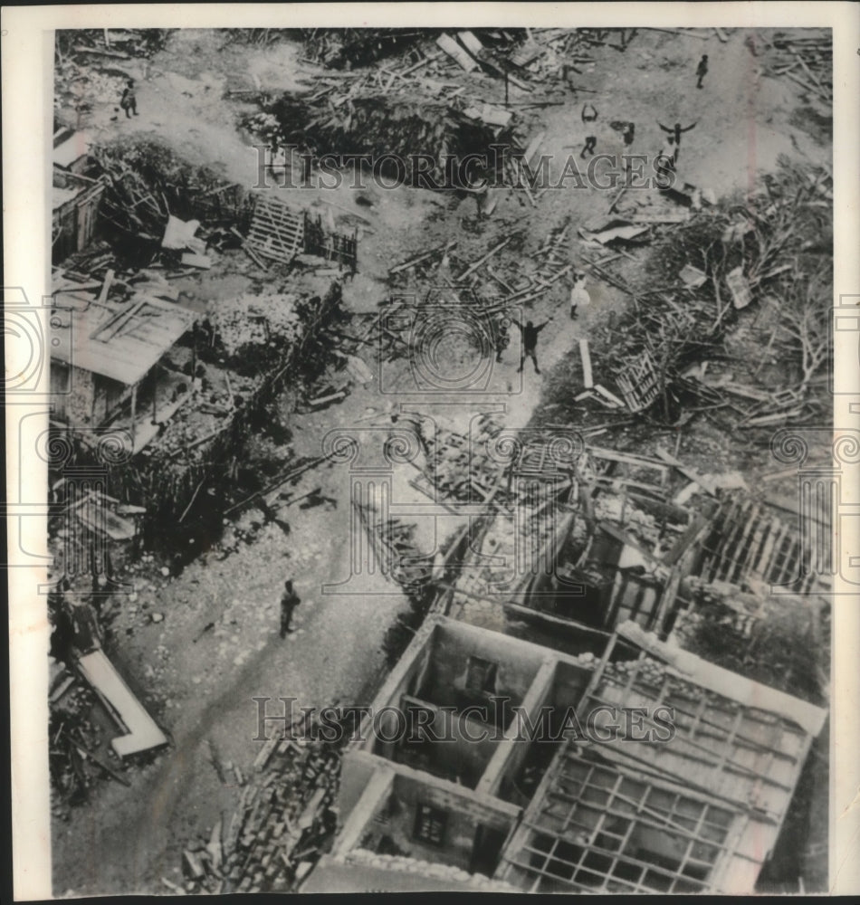 1963 Press Photo Aerial view, people wave, debris from hurricane Flora, Haiti - Historic Images