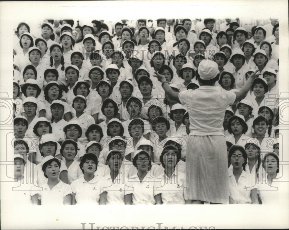1966, Young people sing at Sokagakkai athletic event, Tokyo - Historic Images