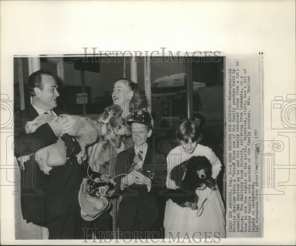 1957 Family pets greet Red Skelton and family home from Europe trip - Historic Images