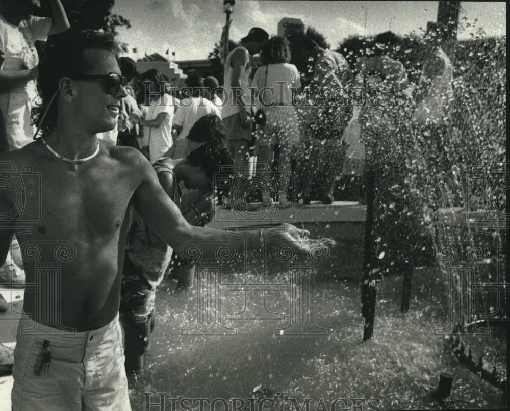 1990 Greg Dison, others play in fountains at Summerfest, Minnesota - Historic Images