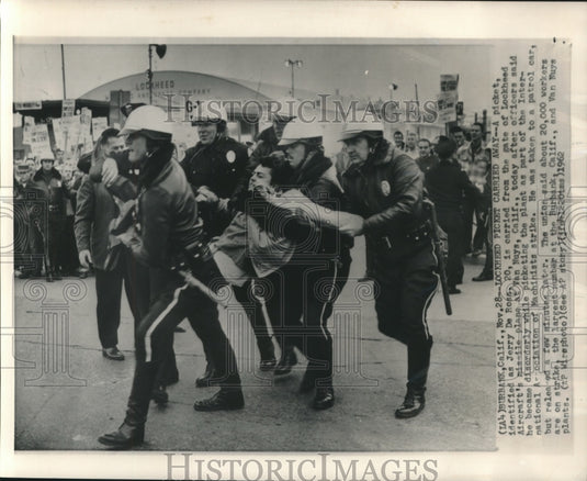 1962 Press Photo Jerry De Ross carried from Lockheed Aircraft's plane gate - Historic Images