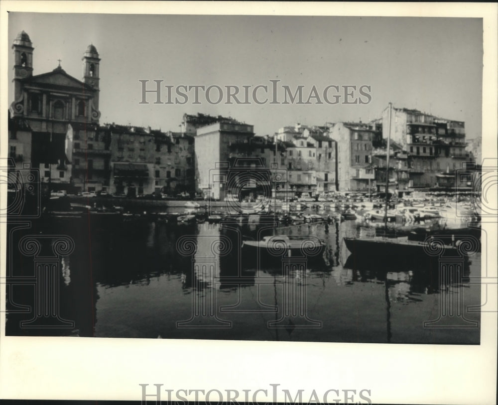 1987 Buildings crowd along waterfront in Bastia, Corsica - Historic Images