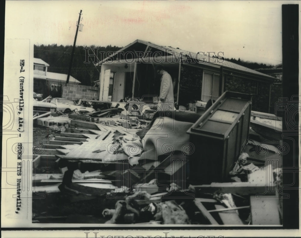 1967 Press Photo Man looks through house wreckage after tornado in Huntsville-Historic Images