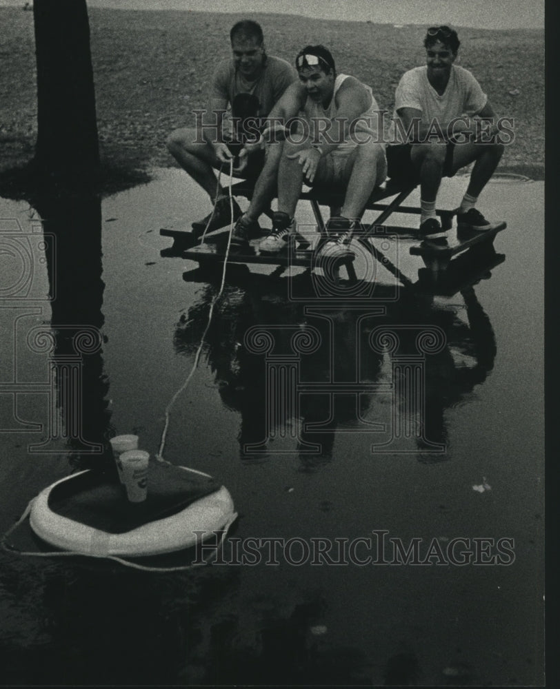 1991, Rain floods Summerfest, three men&#39;s inventive way to get drinks - Historic Images