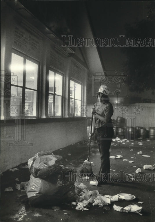 1981, Amy Sperber cleaned up trash after Summerfest closed - Historic Images