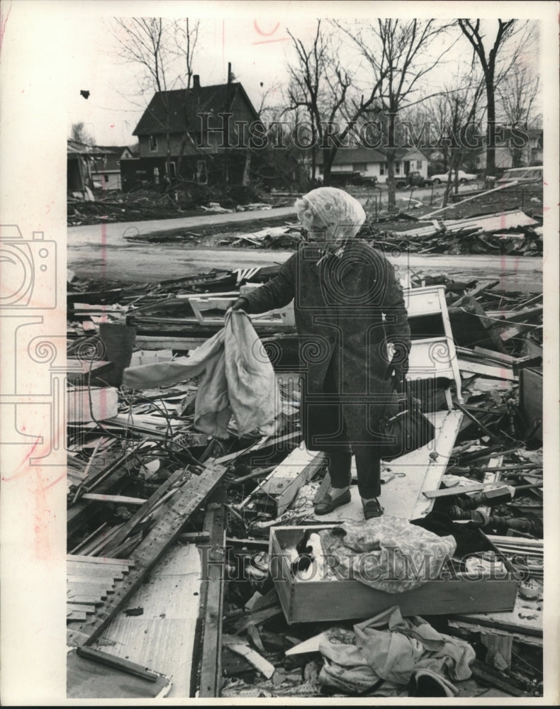 1967 Press Photo Rose Symonds sifts through tornado debris, Belvidere, Illinois-Historic Images
