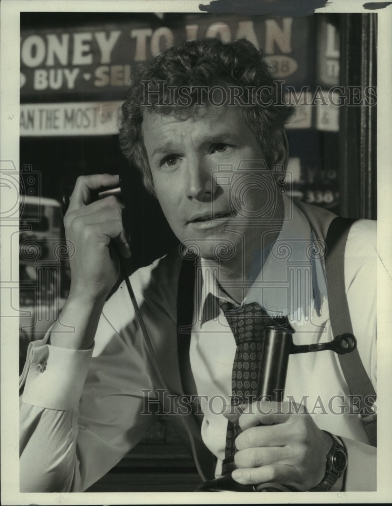 1970 Press Photo Wayne Rogers talking into old style telephone. - mjc05794 - Historic Images