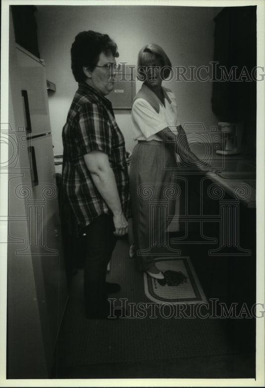 1993, Transitional Living Services' Deb Ligas, shows apartment - Historic Images