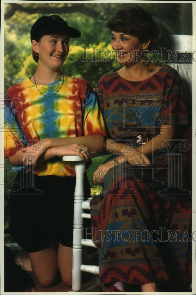 1993, Trish Harris looking at her daughter Melinda discussing things. - Historic Images